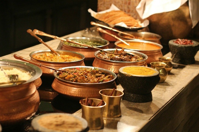 buffet table with Indian curries Table laden with Indian curries
