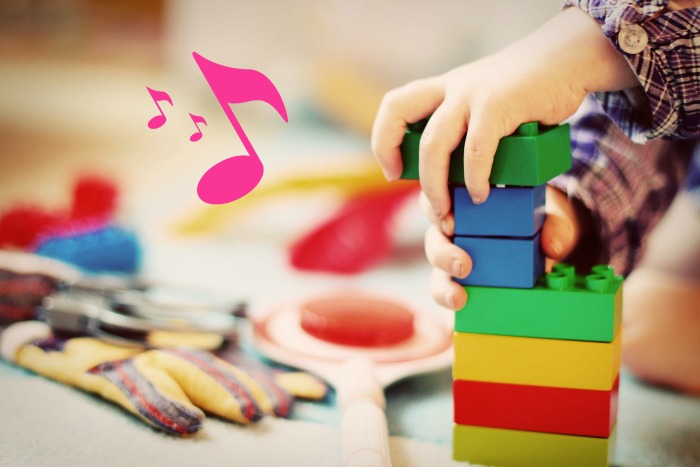 Child putting away toys