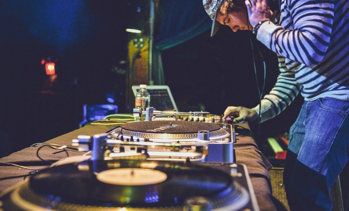 DJ and sound equipment Disc Jockey with some records in a studio