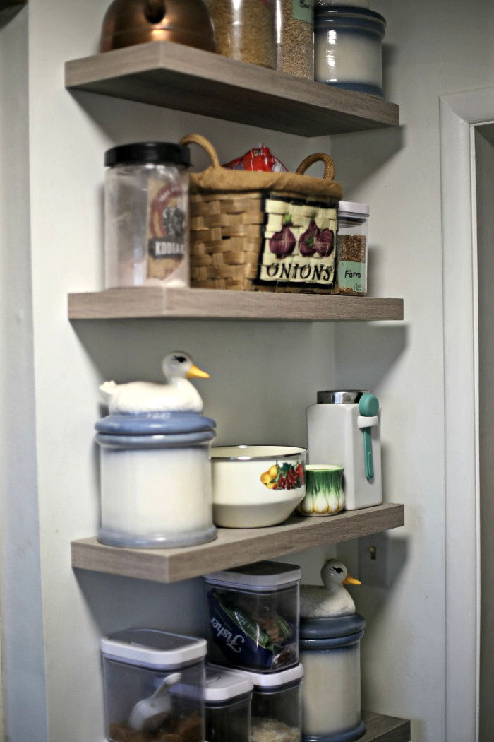 floating shelves with kitchen items Floating kitchen shelves