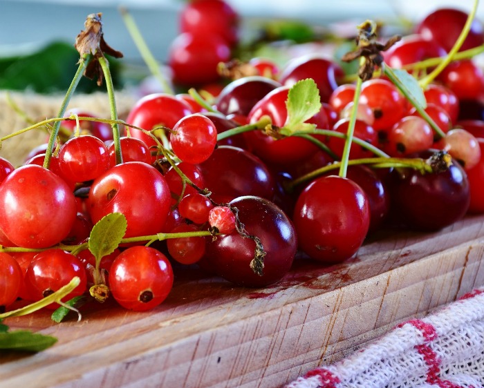 Sour cherries on a wooden board