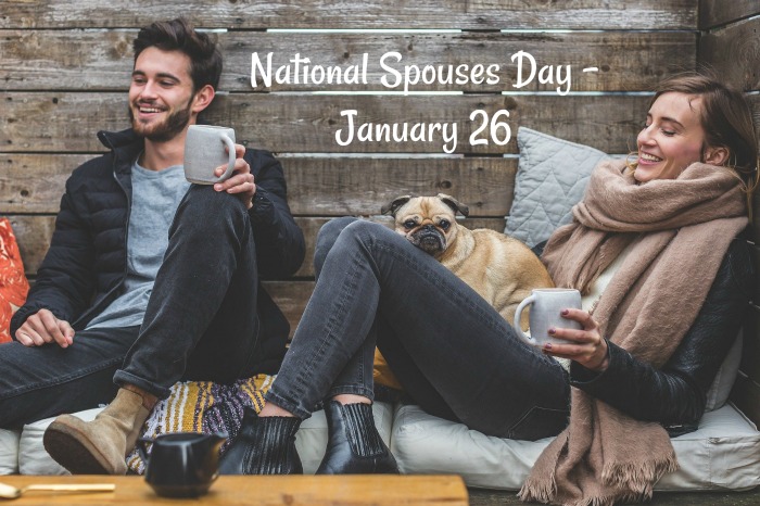couple on cushions with a dog and coffee National Spouses Day is January 26