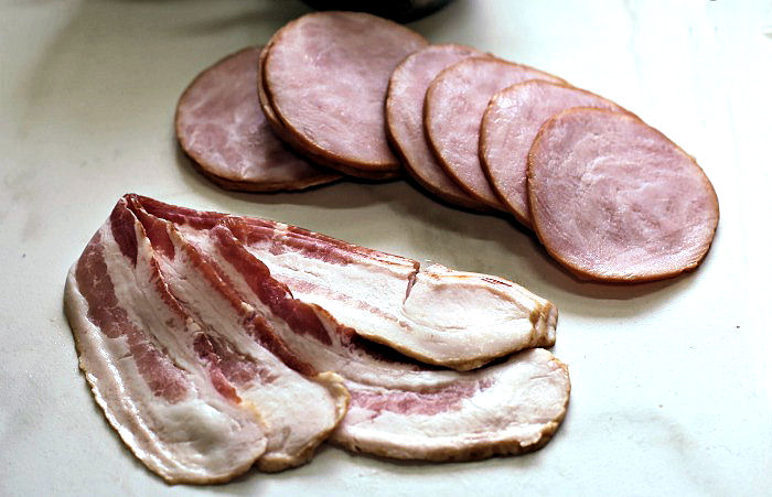 Canadian bacon and regular bacon slices Regular bacon and Canadian bacon