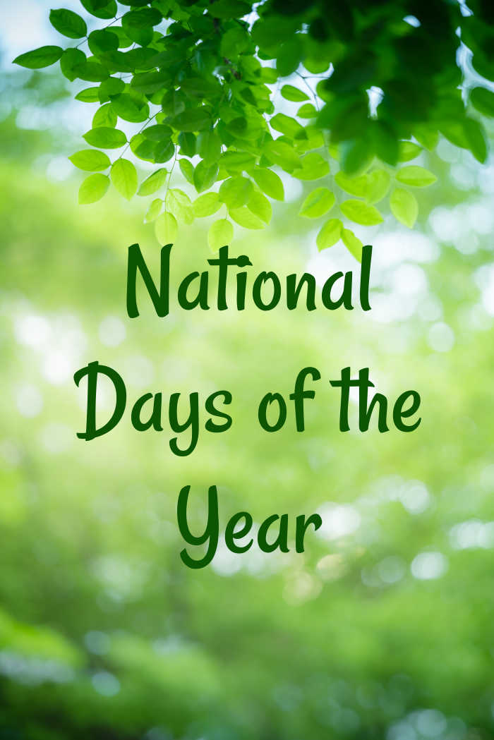 Trees fading out of focus into a green bokeh background with words national days of the year in green lettering on top of it.