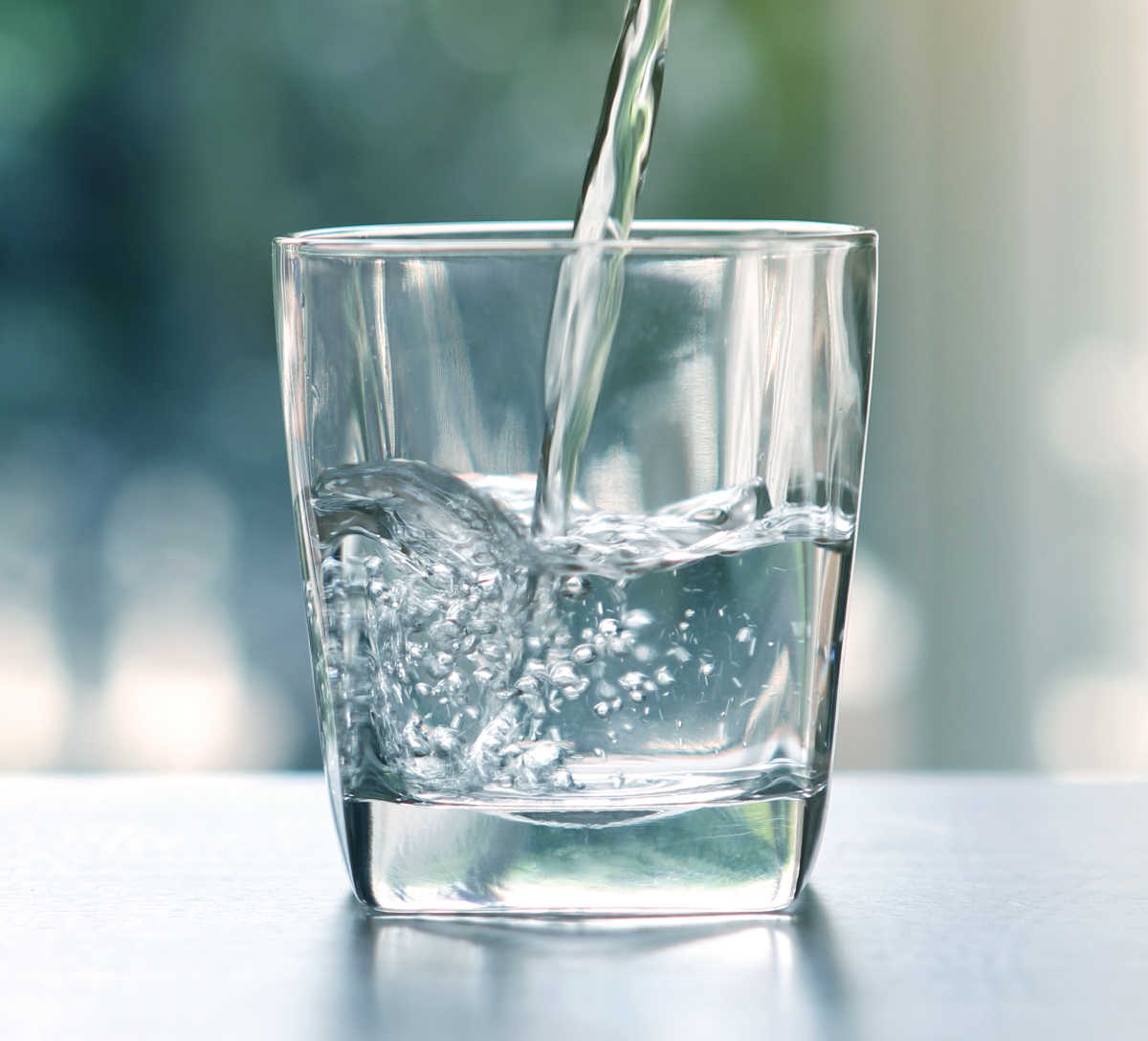 World Water Day Water pouring into a clear glass.