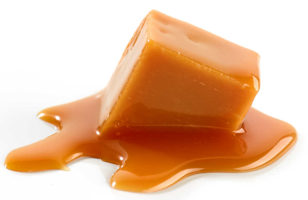 Melted caramel on a white background.