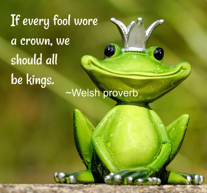 Frog with a crown and a quote overlay. A fake green frog with a silver crown and an April Fool's Day quote text overlay.