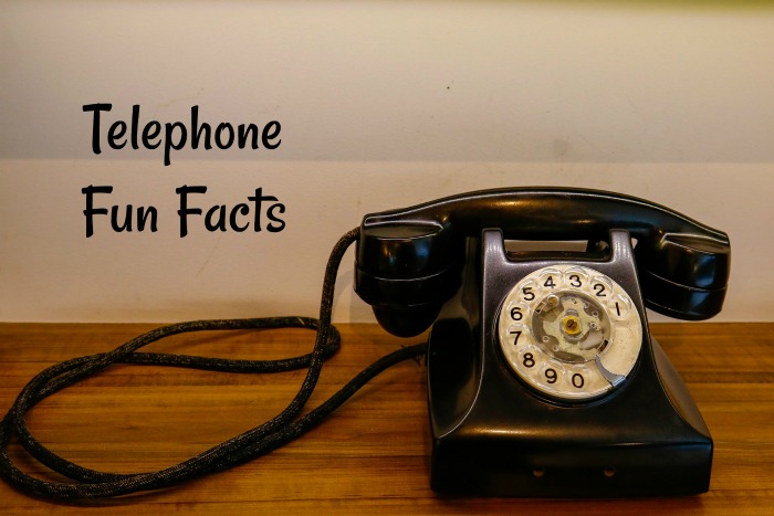 black rotary dialed telephone on a desk Telephone fun facts