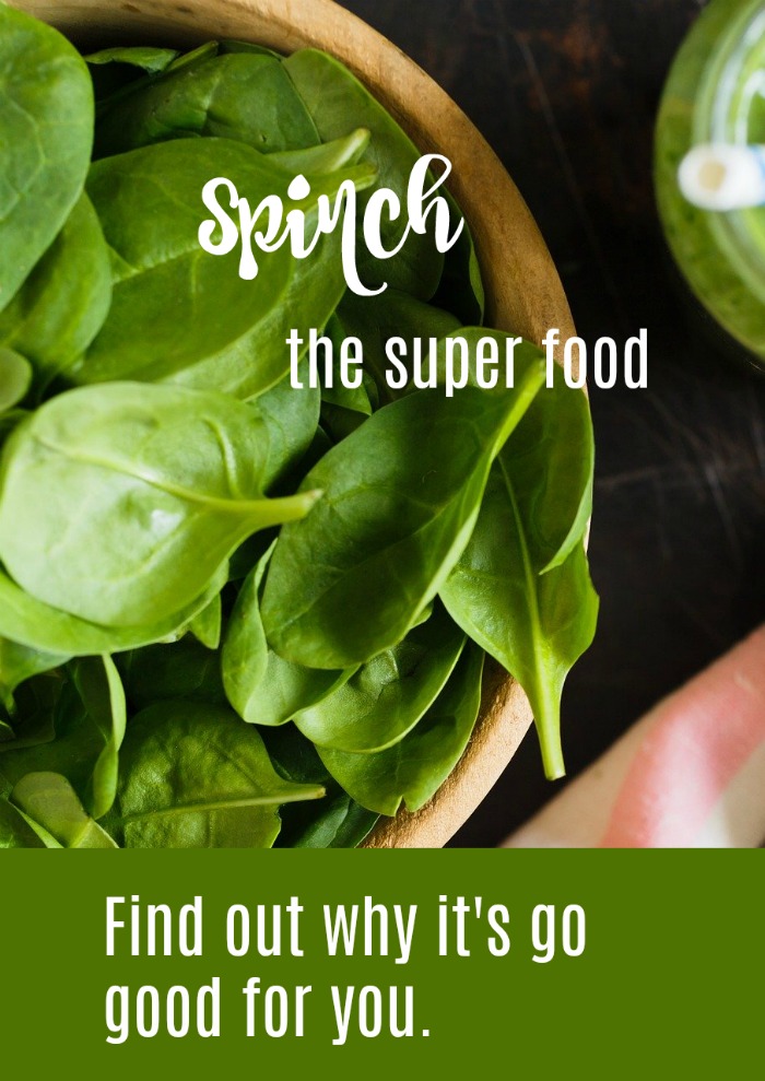 bowl of spinach, the superfood with text overlay Spinach the super food - find out about its nutrition and why it's so good for you