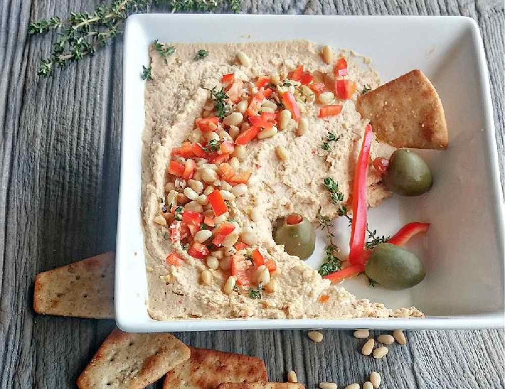 Hummus Day Bowl of roasted red pepper hummus.