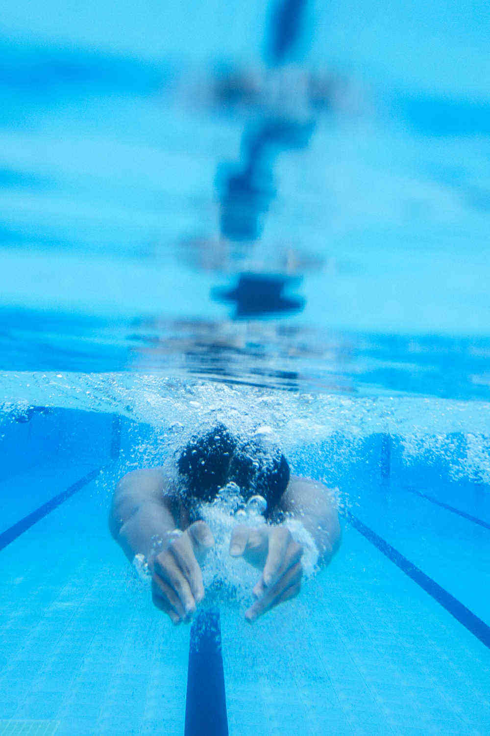 Swimming laps in a pool.