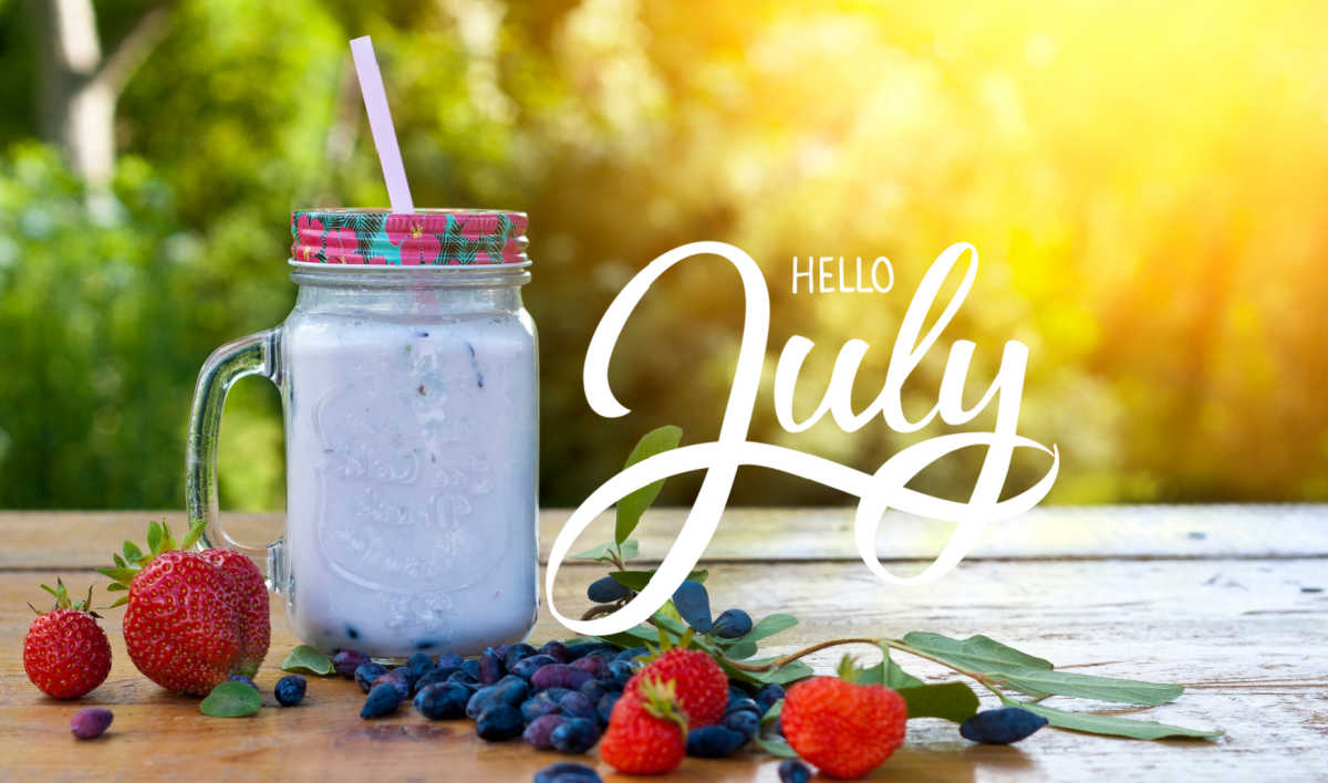 Smoothie with blueberries and strawberries and words Hello July.