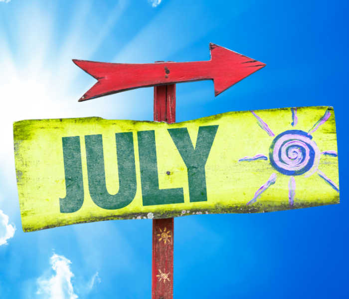 Sign pointing to July. Yellow sign with red arrow and word JULY.
