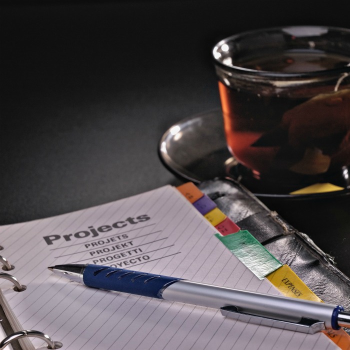 Pen, hot drink and journal