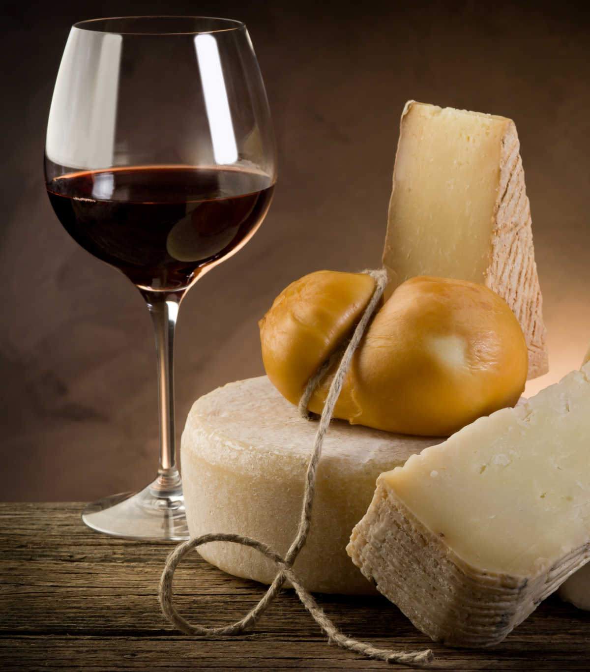 Glass of red wine with cheese.