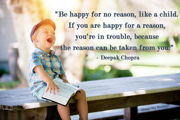 A little boy sitting on a picnic table reading a book and laughing with a text overlay reading "Be happy for no reason, like a child. If you are happy for a reason, you're in trouble, because the reason can be taken from you" - Deepak Chopra Be happy for no reason, like a child. If you are happy for a reason, you're in trouble, because the reason can be taken from you - Be like a child quote