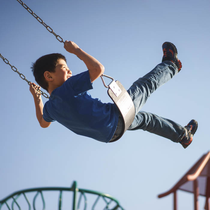 boy on swingset
