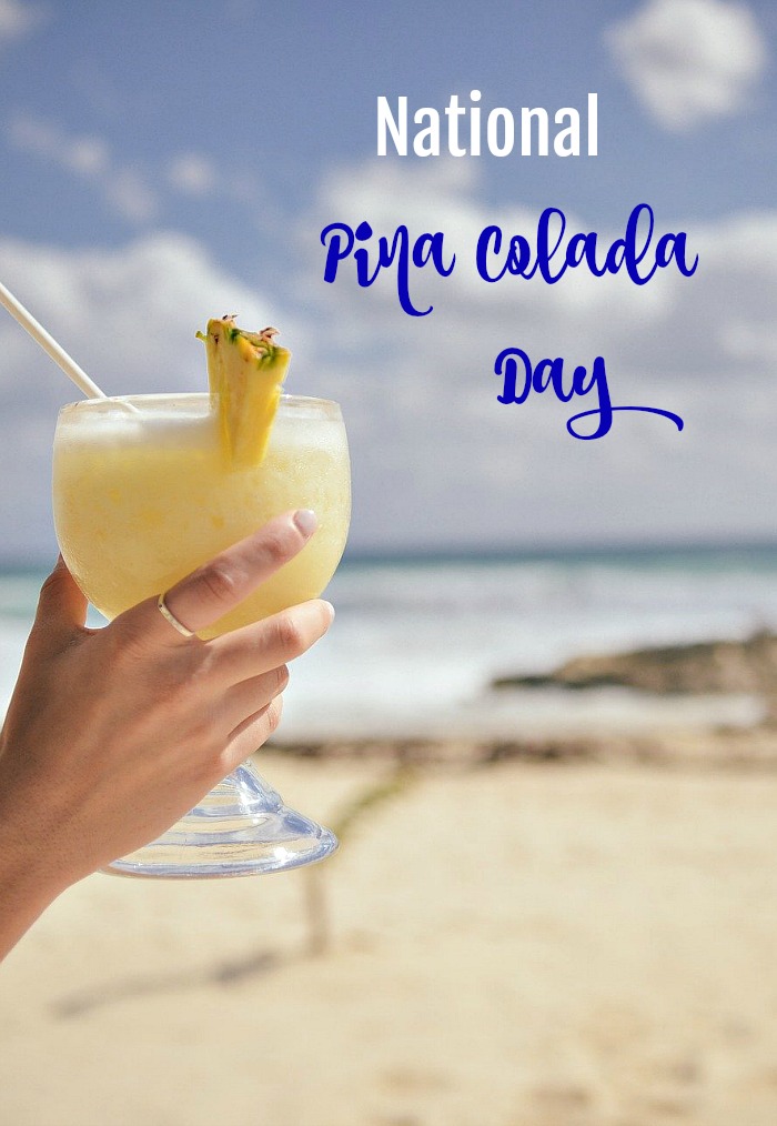 girl holding Pina colada on the beach with words National Pina Colada Day National Pina Colada Day