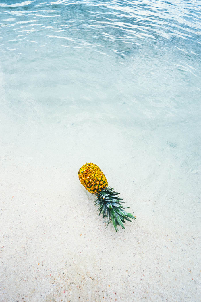 a pineapple on the beach in puerto rico, the home of the pina colada pineapple in puerto rico, the home of the pina colada