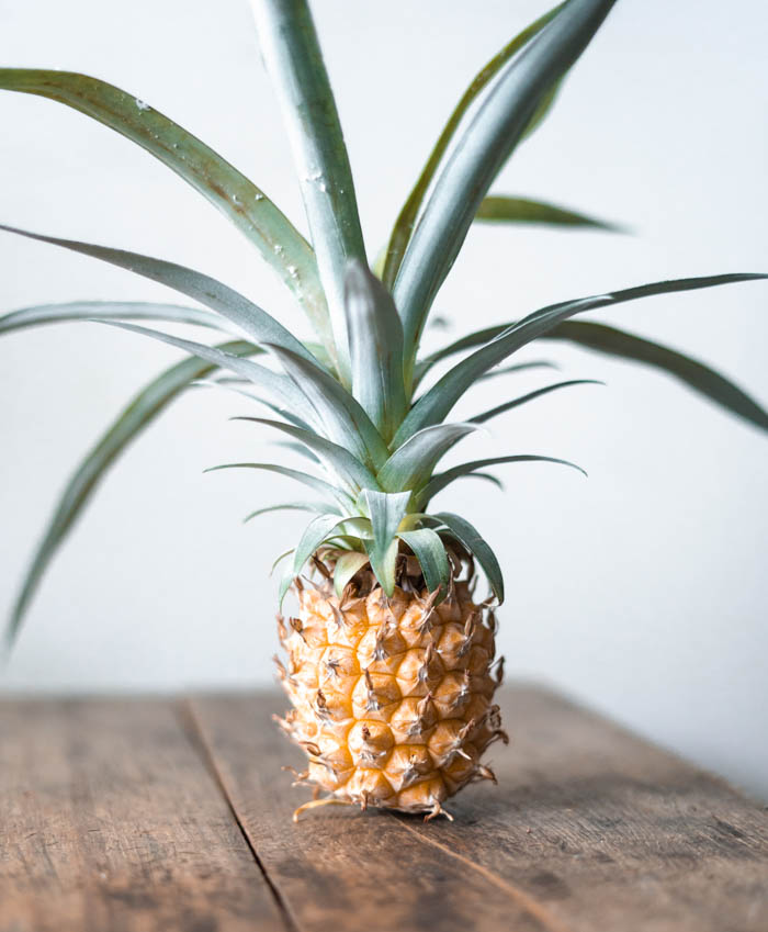 an entire pineapple on a table whole pineapple on a table