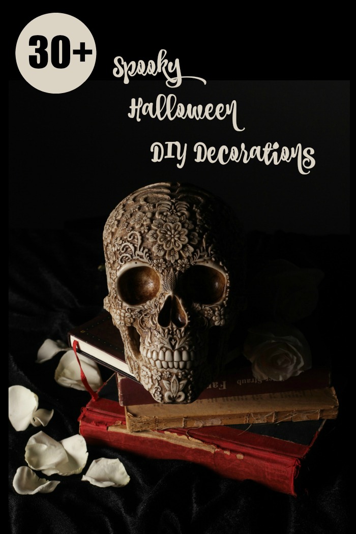 skull on books with rose petals and the wording 30 spooky Halloween DIY decorations 30 DIY Halloween Decorations that are sure to get you in the mood