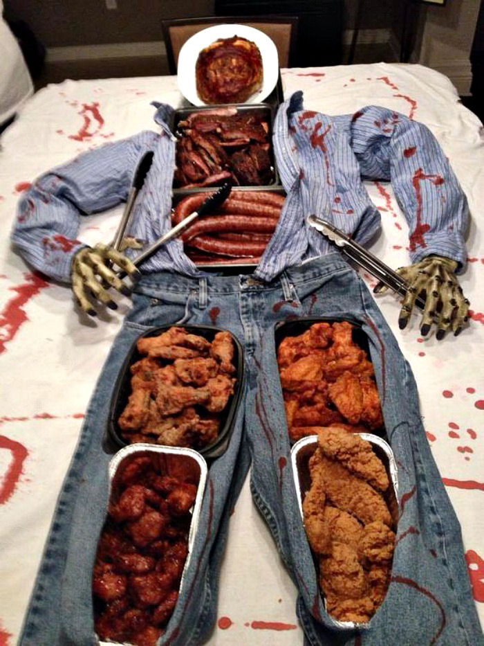 Buffet of a corpse filled with party food Halloween buffet display