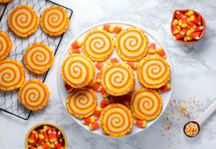 a plate of candy corn spiral cookies for a halloween treat Halloween treats - candy corn and candy corn rolls