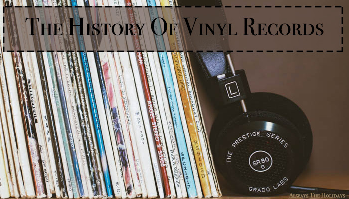 a stack of records and headphones with a text overlay reading the history of vinyl records history of vinyl records