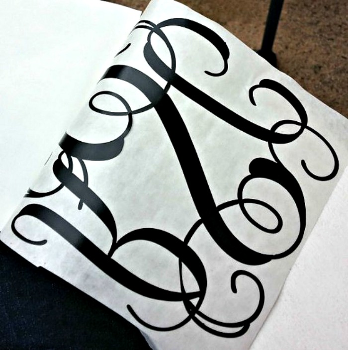 peeling a sheet of decals off backing paper peeling decals