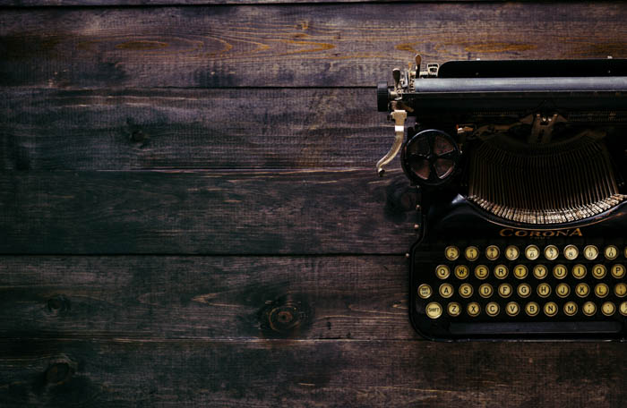 typewriter on a wooden table typewriter