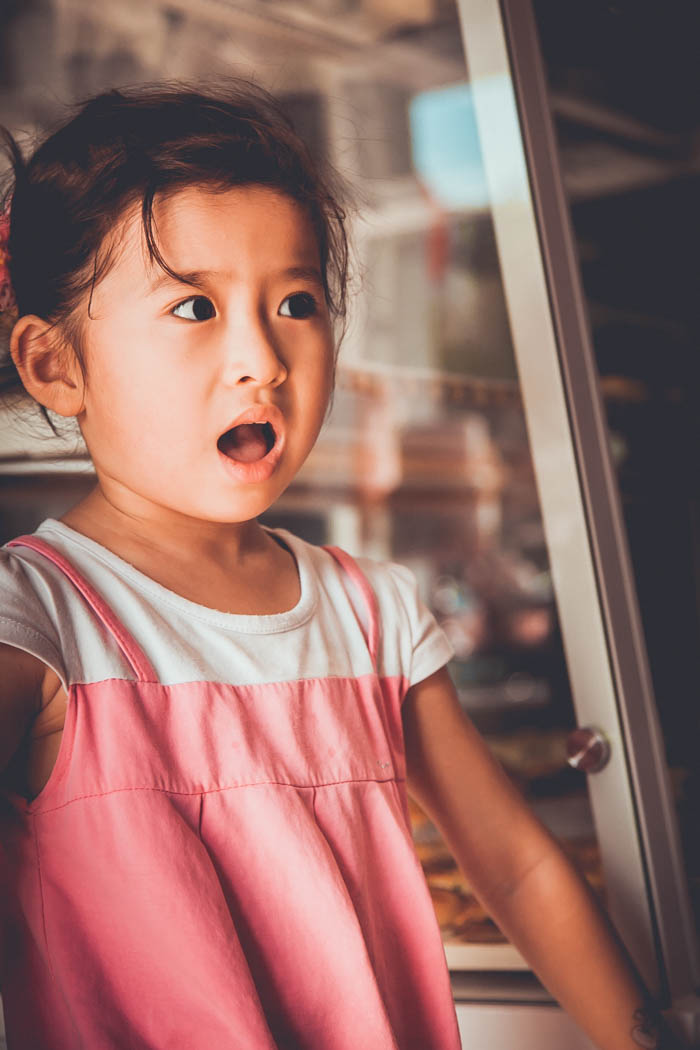 A little girl with an expression of surprise on her face little girl who is surprised by gossip