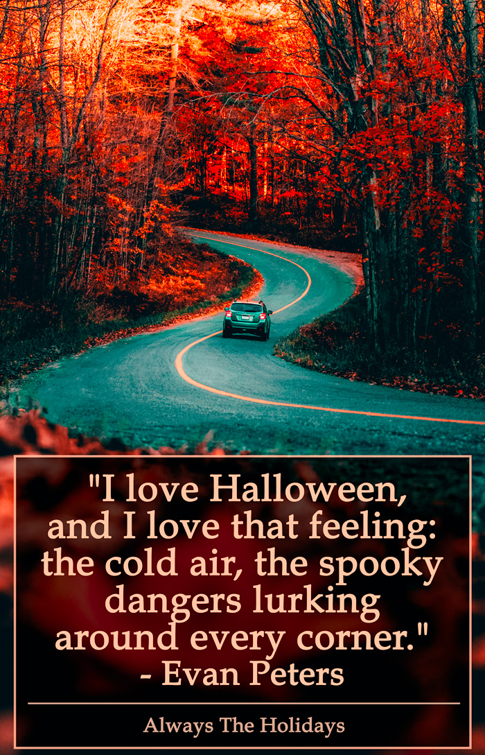 A car on a fall road with a Halloween quote. A car driving down a winding road in the fall with a quote about Halloween on it.