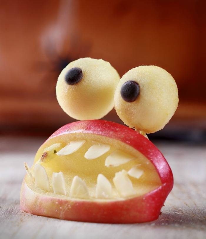 Mouth monster with apple eyeballs. Apple mouth with slivered almond teeth and apple eyeballs.
