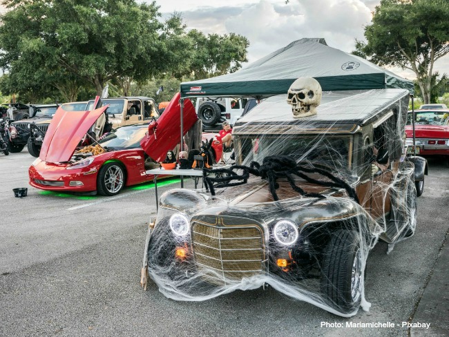Spider and skulls on a vintage car Classic car with Halloween decorations