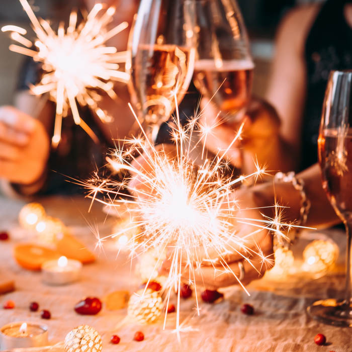 A holiday celebration with sparkling rose and sparklers. A holiday celebration with sparkling rose and sparklers.