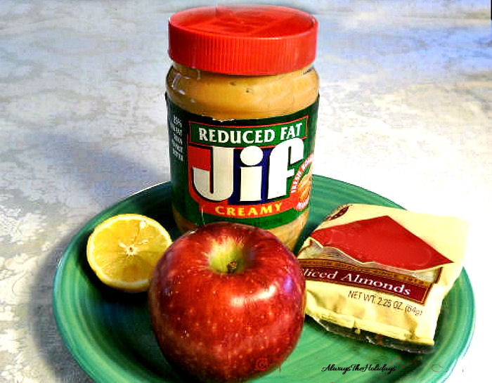 Peanut butter, walnuts, lemon slice and apple.