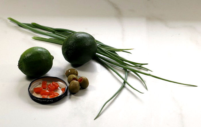 Limes, pimentos, spring onions and skewers.