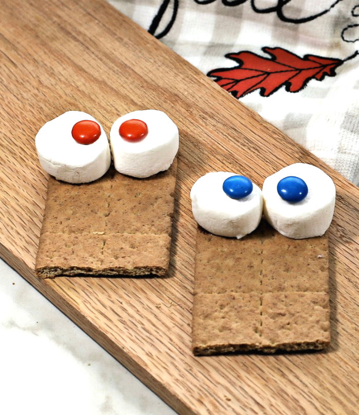 making owl eyeballs Marshmallows and MMs to make eyeballs.