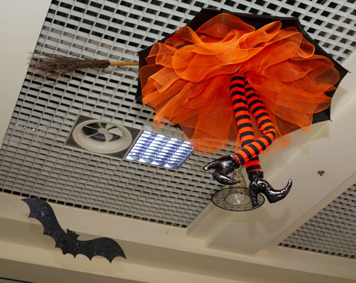 Orange and black witch legs decoration.