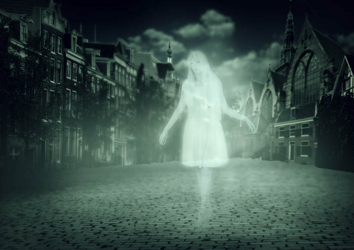 A ghostly woman walking through a spooky ghost town. A ghostly woman walking through a spooky ghost town.