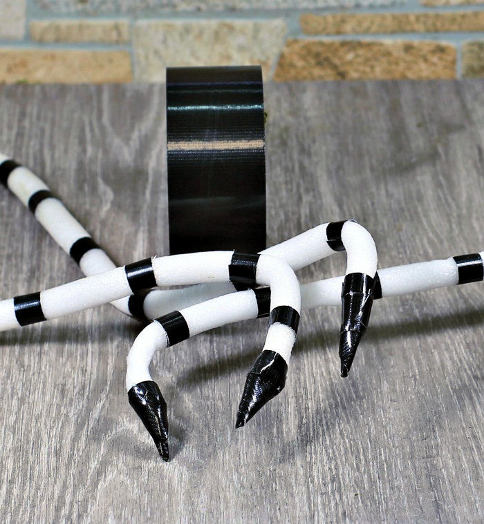 Forming snake heads Making snake heads on the end of foam dowels.