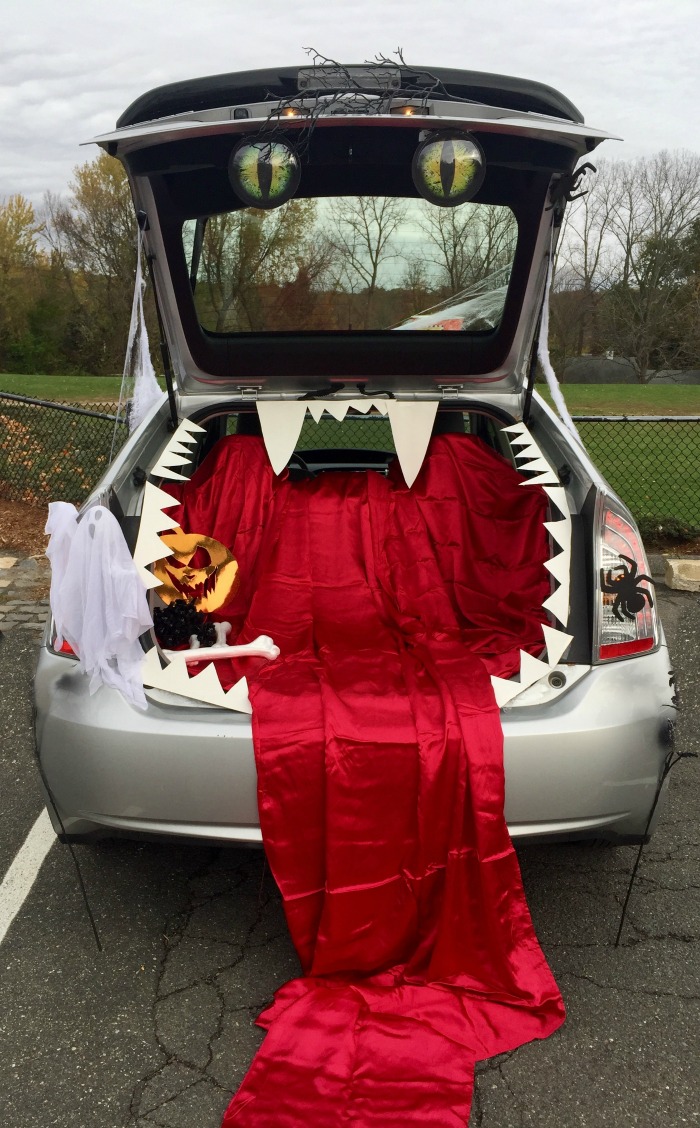 Blood curdling car boot scene. Halloween car decorations - A Car trunk decorated like a mouth and blood.