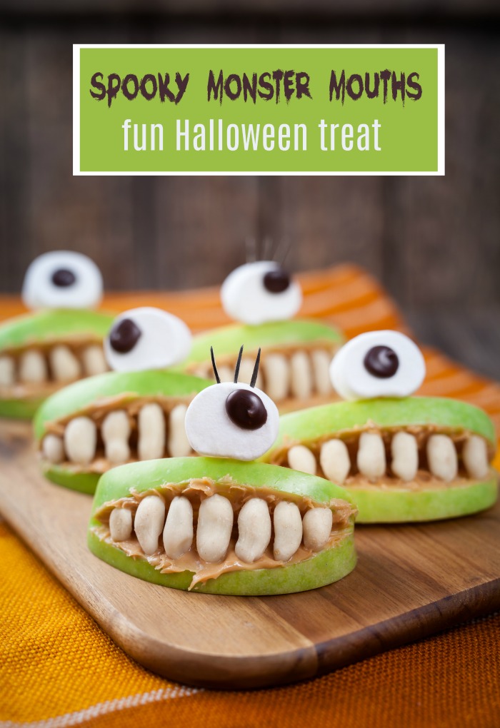 Monster mouths on a cutting board. Apples made into mouths with big eyes and text reading "Spooky monster mouths - fun Halloween snack."