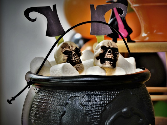 Witches cauldron Marshmallows in a black cauldron with witch feet and skulls.