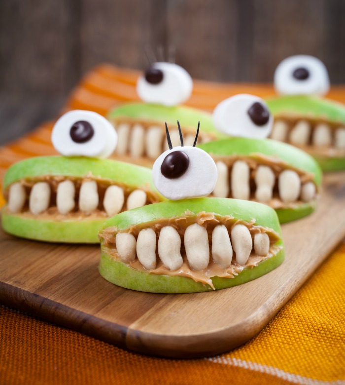 Spooky mouth apples Yogurt raisons in mouth apples with big eyeball.