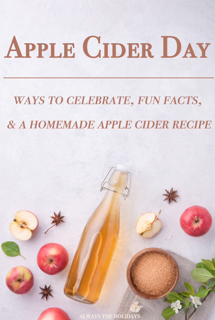 An overhead view of apple cider ingredients on a marble background with a text overlay for Apple Cider Day. An overhead view of apple cider ingredients on a marble background with a text overlay reading "Apple cider day ways to celebrate fun facts & a homemade apple cider recipe".