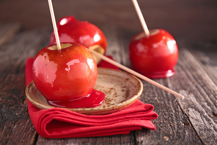 Three candy apples arranged artistically. A dessert made of simple candy apple ingredients.