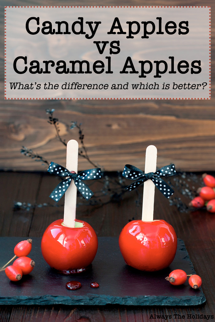 Two candy apples on a slate serving platter with black polka dot bows on them. Two candy apples with black polkadot bows on them, on a slate serving board with a text overlay reading "candy apples vs caramel apples what's the difference and which is better?".