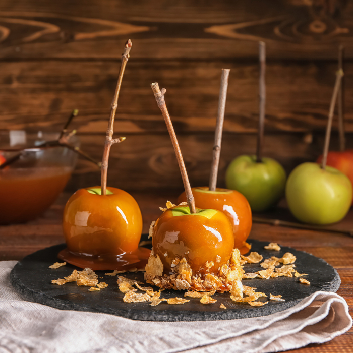 Three breakfast inspired caramel apples with cornflake toppings. Three breakfast inspired caramel apples with cornflake toppings.