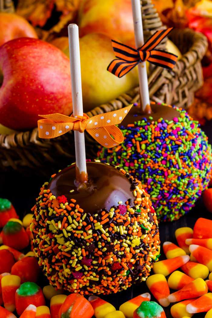 Decorated caramel apples Two caramel apples for Halloween with sprinkles.